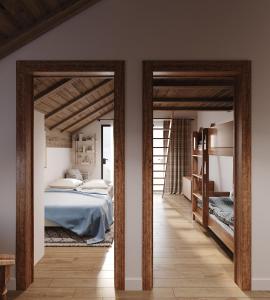 a bedroom with two beds and two mirrors at Tarbey Alpine Apartment Leukerbad in Leukerbad