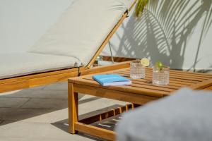 a wooden table with a bed and books on it at Casa Aulaga in Yaiza