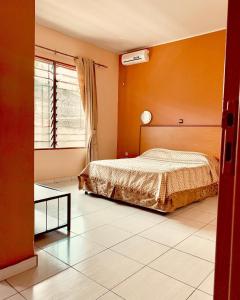 Кровать или кровати в номере Burundi Sweet Home