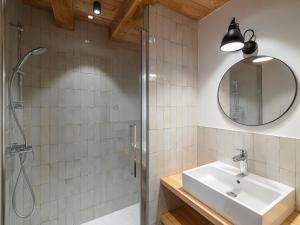 a bathroom with a sink and a shower at Maison rénovée familiale au village - FR-1-808-19 in Le Monêtier-les-Bains +6 photos