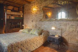 a bedroom with a bed and a mirror and a table at officina alchemica in Calcata +23 photos