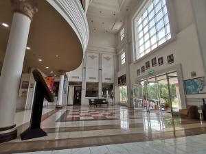 a large building with a lobby with a large window at Hotel Seri Malaysia Kulim in Kulim