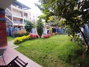 a garden in the middle of a building at Rustic Roots Inn in Bangalore