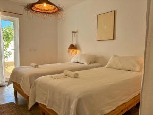 Ένα ή περισσότερα κρεβάτια σε δωμάτιο στο Casa Pátio Grândola