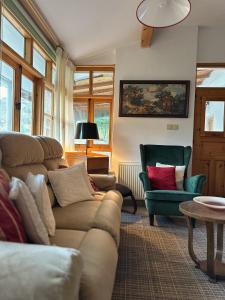 a living room with couches and a table and chairs at Eria Moutoullas House in Moutoullas