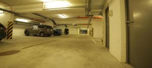 an empty parking garage with cars parked in it at B&B HOTEL Wrocław Centrum in Wrocław +58 photos