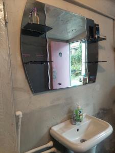 a bathroom with a sink and a mirror at Ojakh in Dilijan +49 photos