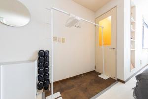 a living room with a glass door and a lamp at Joyful JUJO Stay 1minute walk from JR Jujo Station Shibuya 15min Shinjuku 11min Ikebukuro 6min Max 6guests 33square meters Simmons bed in Tokyo +42 photos
