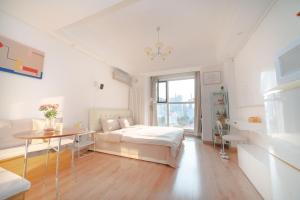 Ένα ή περισσότερα κρεβάτια σε δωμάτιο στο Xiao Meow B&B