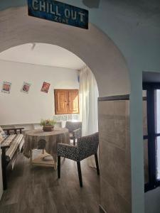 a living room with a table and a dining room at El Patio de Doña Tere in Villarta de San Juan +9 photos