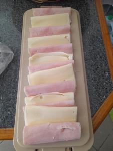 a tray filled with different types of cheese at Encanto da Aldeia in Torre de Moncorvo