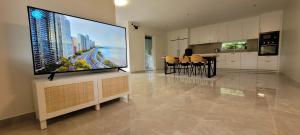 a living room with a large flat screen tv at Modern Full Comfort Villa in Agnesberg