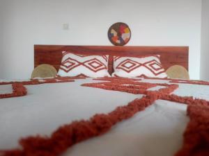 a bedroom with a bed with snow on it at ESPACE COLIBRI in Palmarin