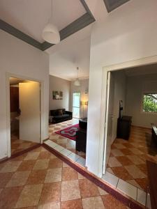 a large living room with a couch and a table at Spacious appartment in center harhoura in Temara