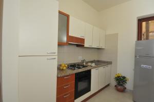 Kuchyň nebo kuchyňský kout v ubytování Residence Sicilia Mare- casa vacanza Scoglitti + 28 fotografií