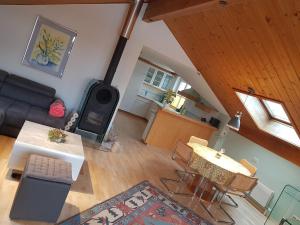 an overhead view of a living room with a couch and a table at Chalet Himmelblick in Dornbirn