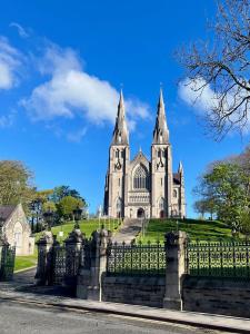 a church with a fence in front of it at 31 Lower English in Armagh