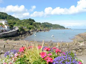 a view of a beach with flowers at Mill Apartment - Ukc3784 in West Down