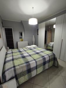 Postel nebo postele na pokoji v ubytování HH IMPERO Locazione Turistica