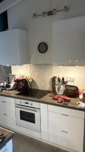 a kitchen with white cabinets and a counter top at Villa Ti Paradis in Sainte-Luce