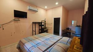 Postel nebo postele na pokoji v ubytování วรรณรีสอร์ทwanresort