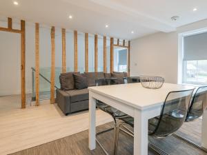 a living room with a table and a couch at The Norfolk-Uk41442 in Brandon