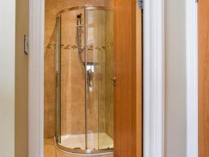 a shower with a glass door in a bathroom at Uk47786 - Flat 4E in Aberystwyth