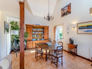 a dining room with a table and chairs at La Bergerie in Stein