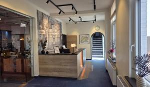 a lobby with a reception desk in a building at Appart-Hotel-Heldt in Bremen