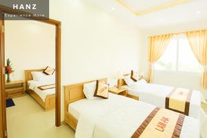 Postel nebo postele na pokoji v ubytování S79 Blue Lam Ha Pool + 2 fotografie