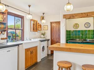 a kitchen with a sink and a dishwasher at Worthy House in Saint Florence