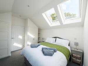 En eller flere senge i et værelse på Beech Cottage - Uk11845