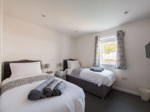 En eller flere senge i et værelse på Beech Cottage - Uk11845 + 17 billeder