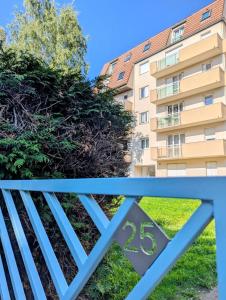 a gate with a building in the background at Appartement ZEN - 5 minutes du centre, parking gratuit in Nancy