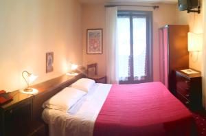 Postel nebo postele na pokoji v ubytování Hotel Alle Alpi