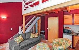 a living room with a couch and a loft at Ferienwohnung Mirow in Mirow