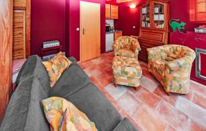 a living room with a couch and two chairs at Ferienwohnung Mirow in Mirow