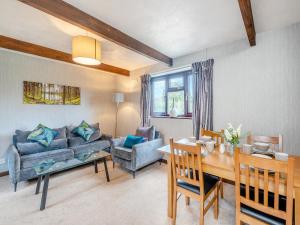 a living room with a couch and a table at Swallow - Uk48172 in Colchester