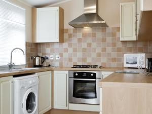 Køkken eller tekøkken på Heron Lodge