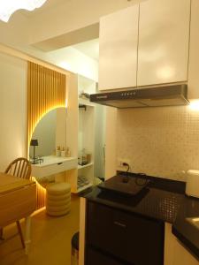 a kitchen with a sink and a counter top at CDO Nest in Cagayan de Oro