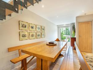 a dining room with a wooden table at Homewood - Uk36205 in Fordingbridge