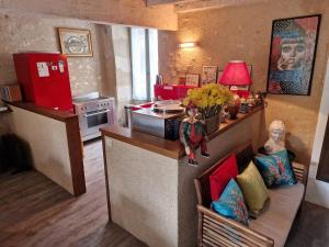 a kitchen with a doll on a counter in a kitchen at Welcome to SWEET HOME in Bélâbre
