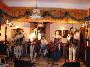 a group of people playing instruments in a room at Apartamenty w Dolinie Kościeliskiej in Kościelisko