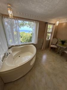 Ванная комната в Hotel Daymond Blue Tropical Lodge +36 фотографий