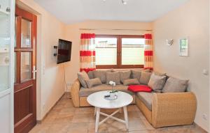 a living room with a couch and a table at Ferienwohnung Zislow in Zislow