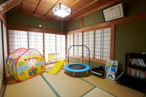 a childs room with a play area with a slide at Cyclist inn Hachikakuno / Vacation STAY 78852 in Shimosato