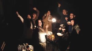 a group of people posing for a picture at night at Cyclist inn Hachikakuno / Vacation STAY 78852 in Shimosato