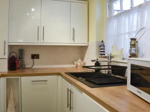 Kuchyň nebo kuchyňský kout v ubytování Wellington Place