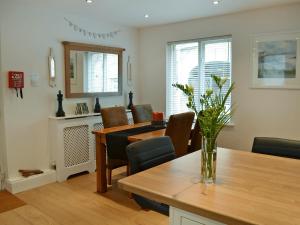 a kitchen and dining room with a table and chairs at The Old Forge in Alnwick