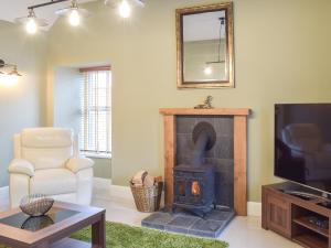 Μια τηλεόραση ή/και κέντρο ψυχαγωγίας στο Dairy Cottage - Uk39522